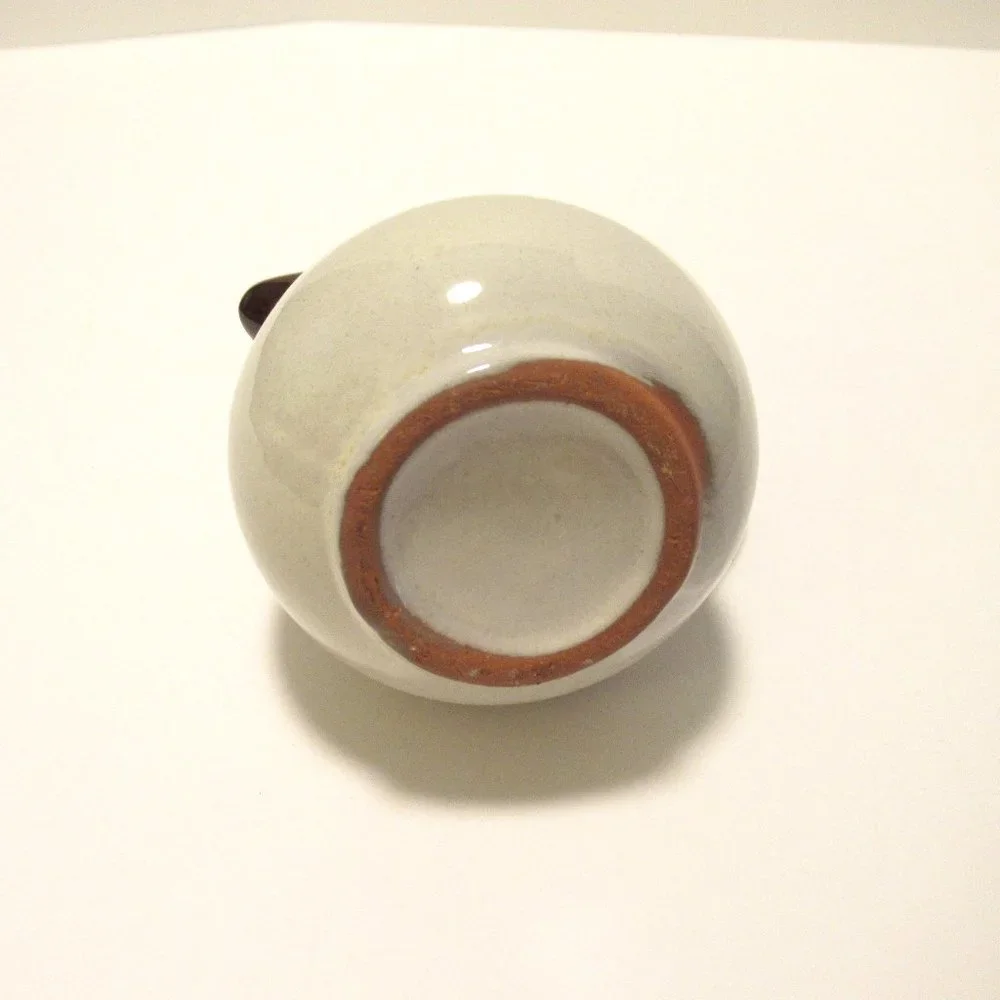 Brown and White Ceramic Serveware Pitcher